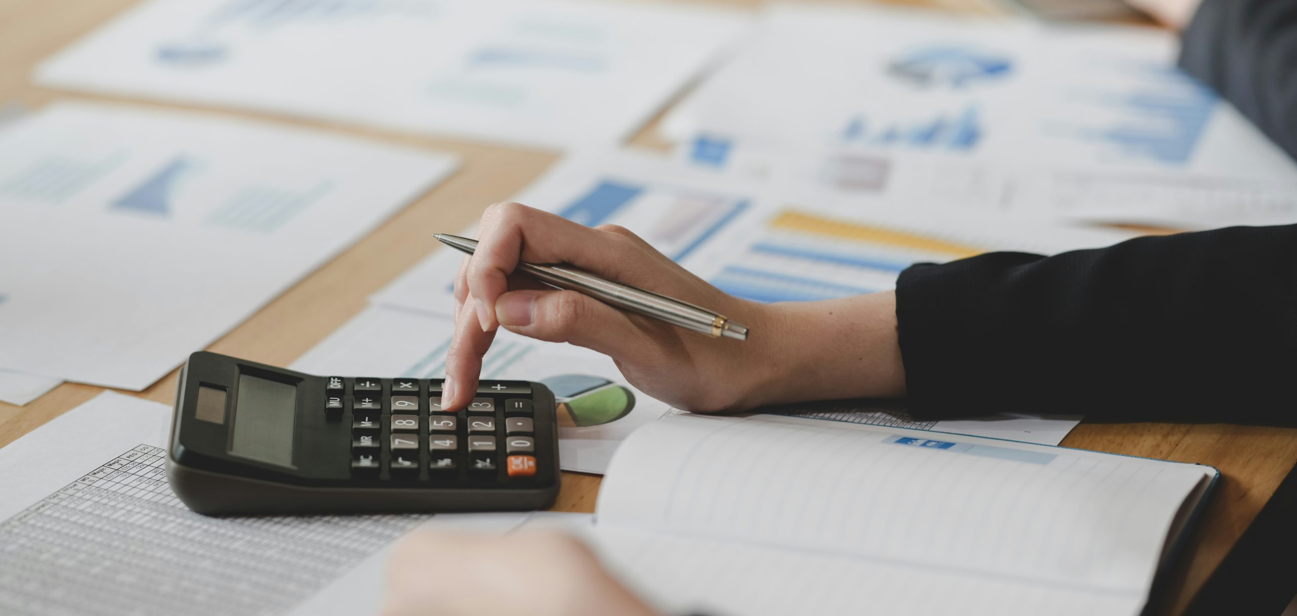 calculators are a tool accountants use to manage finances with pen and paper