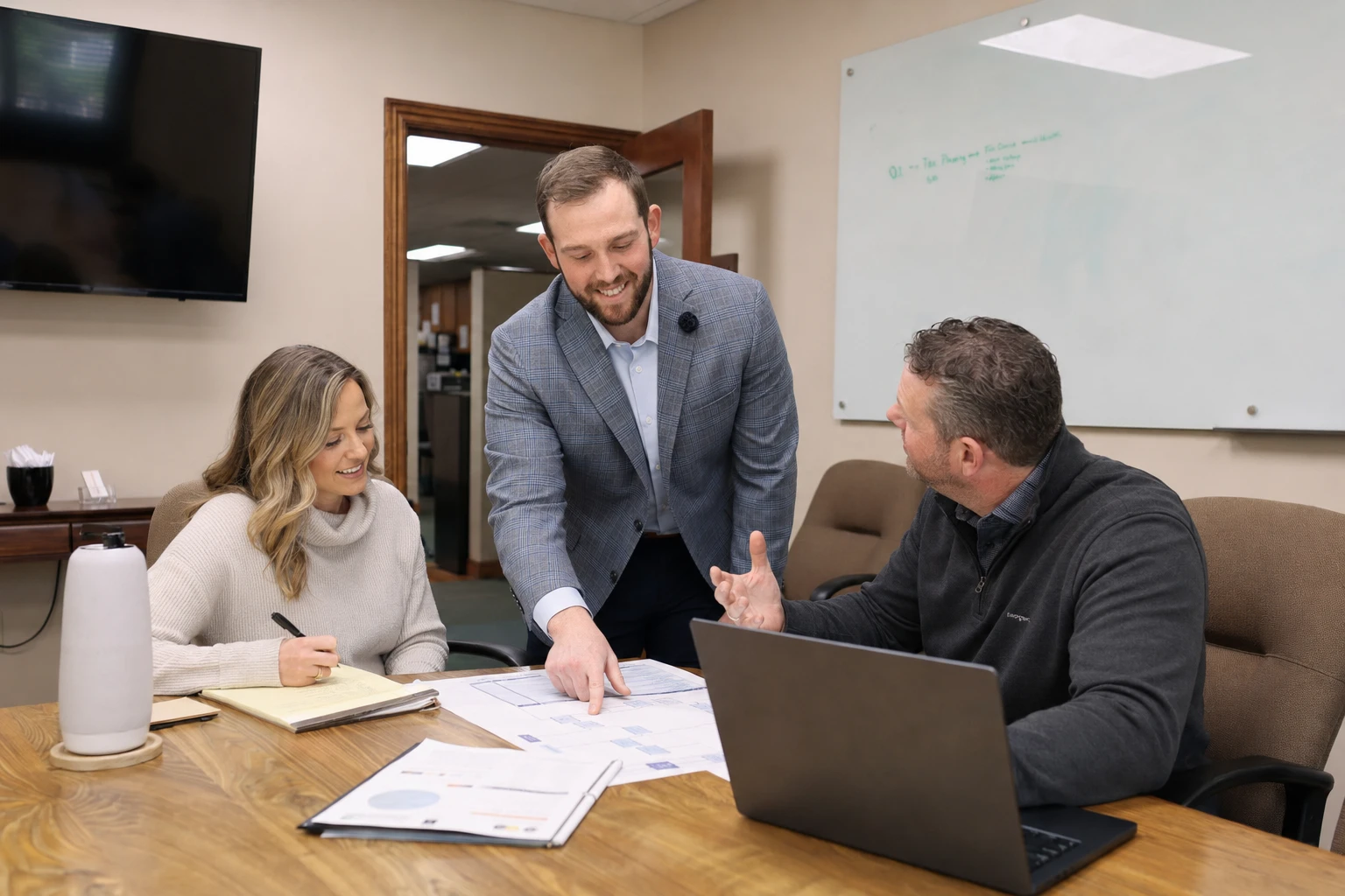 A Cooper Norman advisor leads a planning session with business owners.