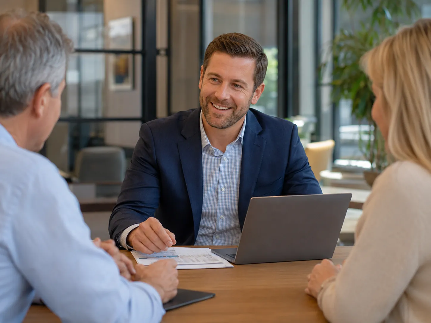 Cooper Norman CPA advisor meeting with clients in a professional office.