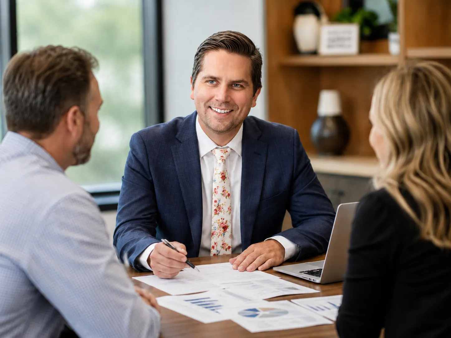 Cooper Norman CPA reviewing tax strategy documents with clients.