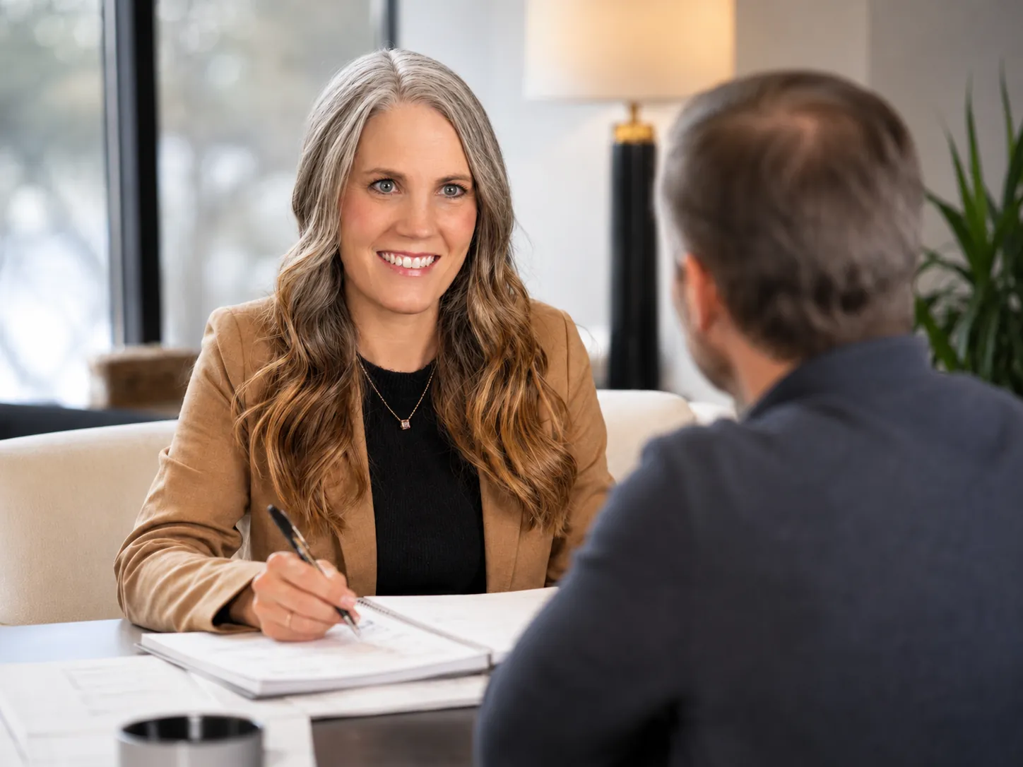 Cooper Norman CPA reviewing tax positions with a business owner.