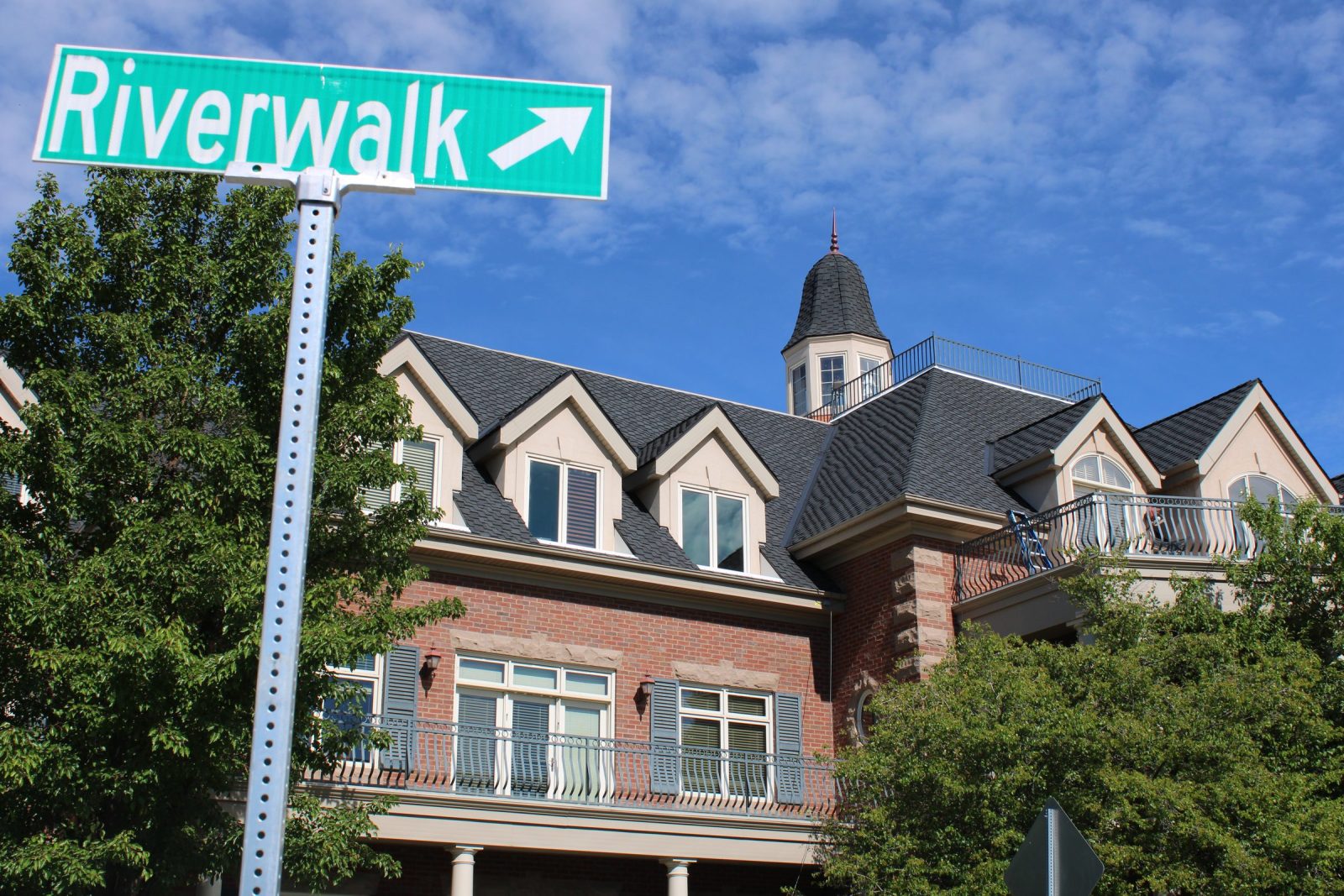 Riverwalk Drive sign in front of the Idaho Falls building that houses Cooper Norman's office